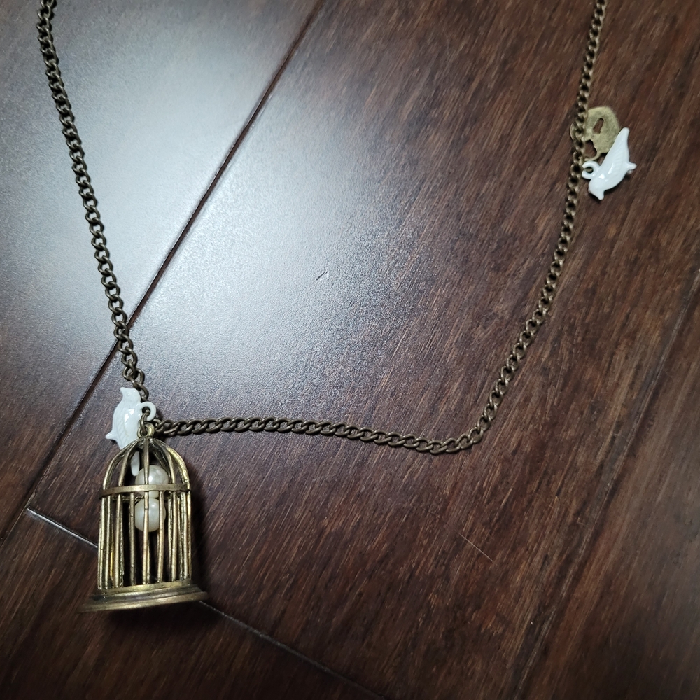 Bronze Birdcage Pendant Necklace with White Accents